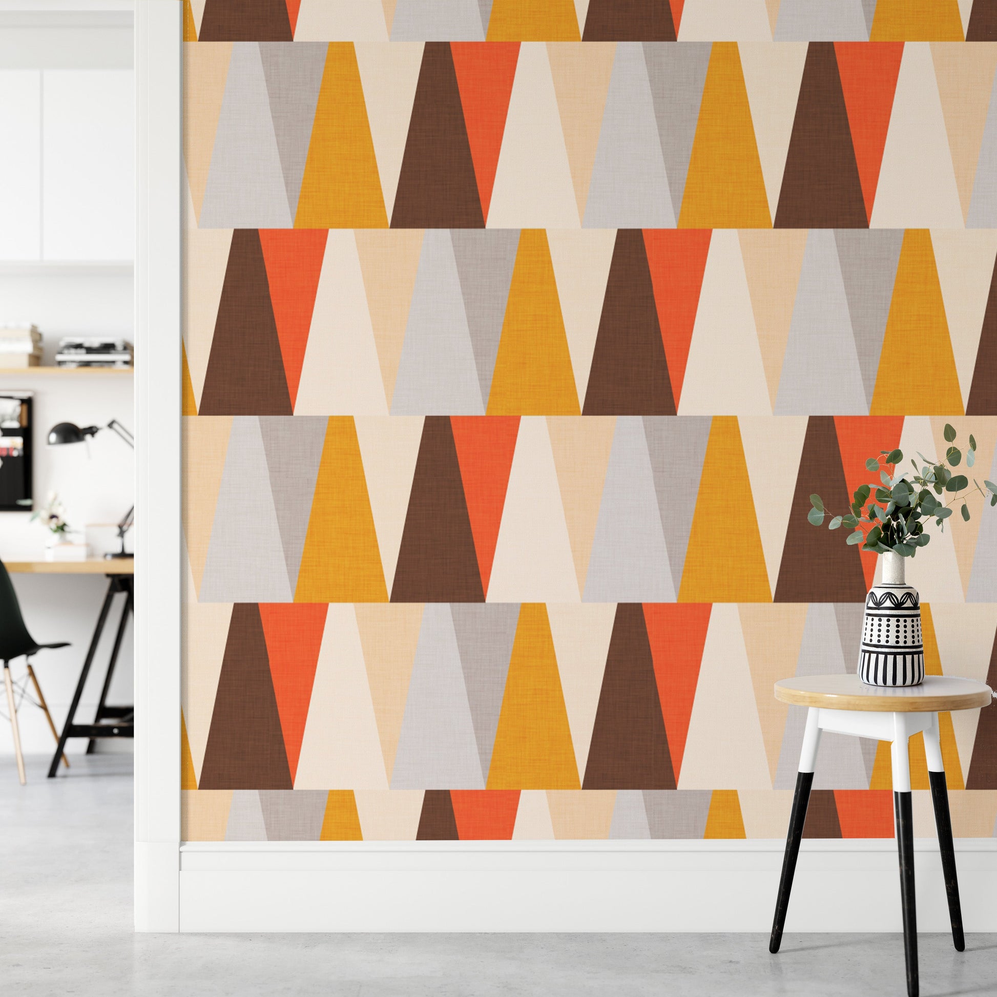 Abstract geometric triangle mural in earthy tones
