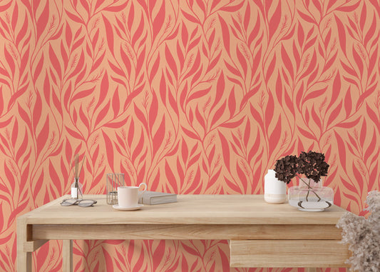 Peach pink wallpaper with leaf patterns
