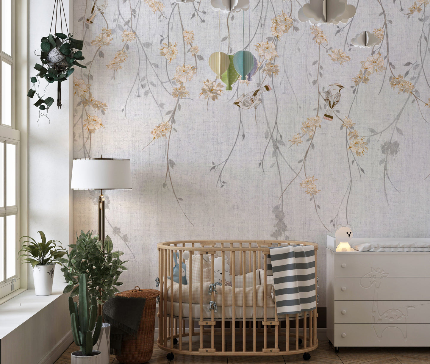 Leafy branch wall mural featuring delicate bird designs.
