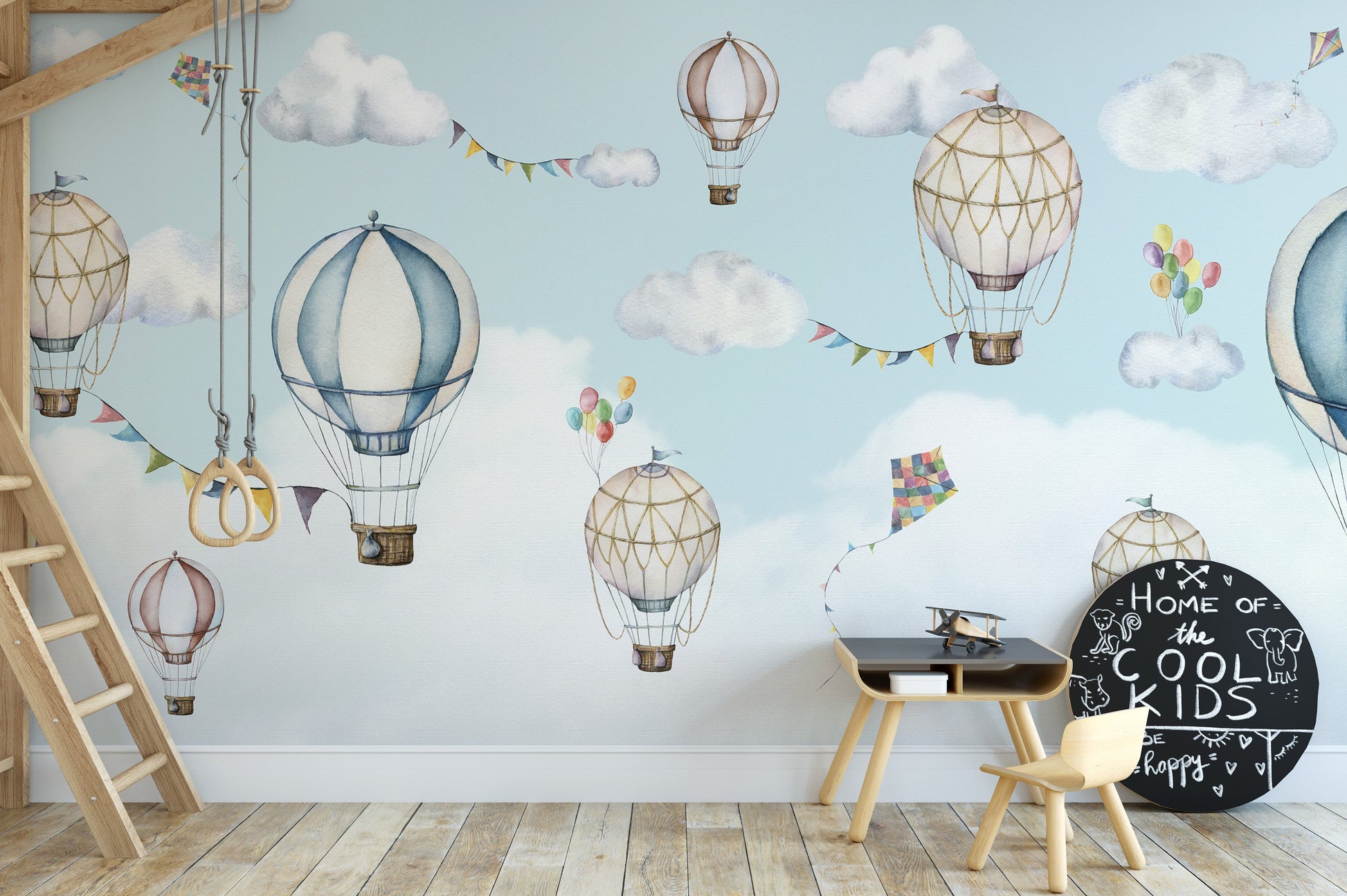 Light and dreamy mural of balloons drifting through the sky