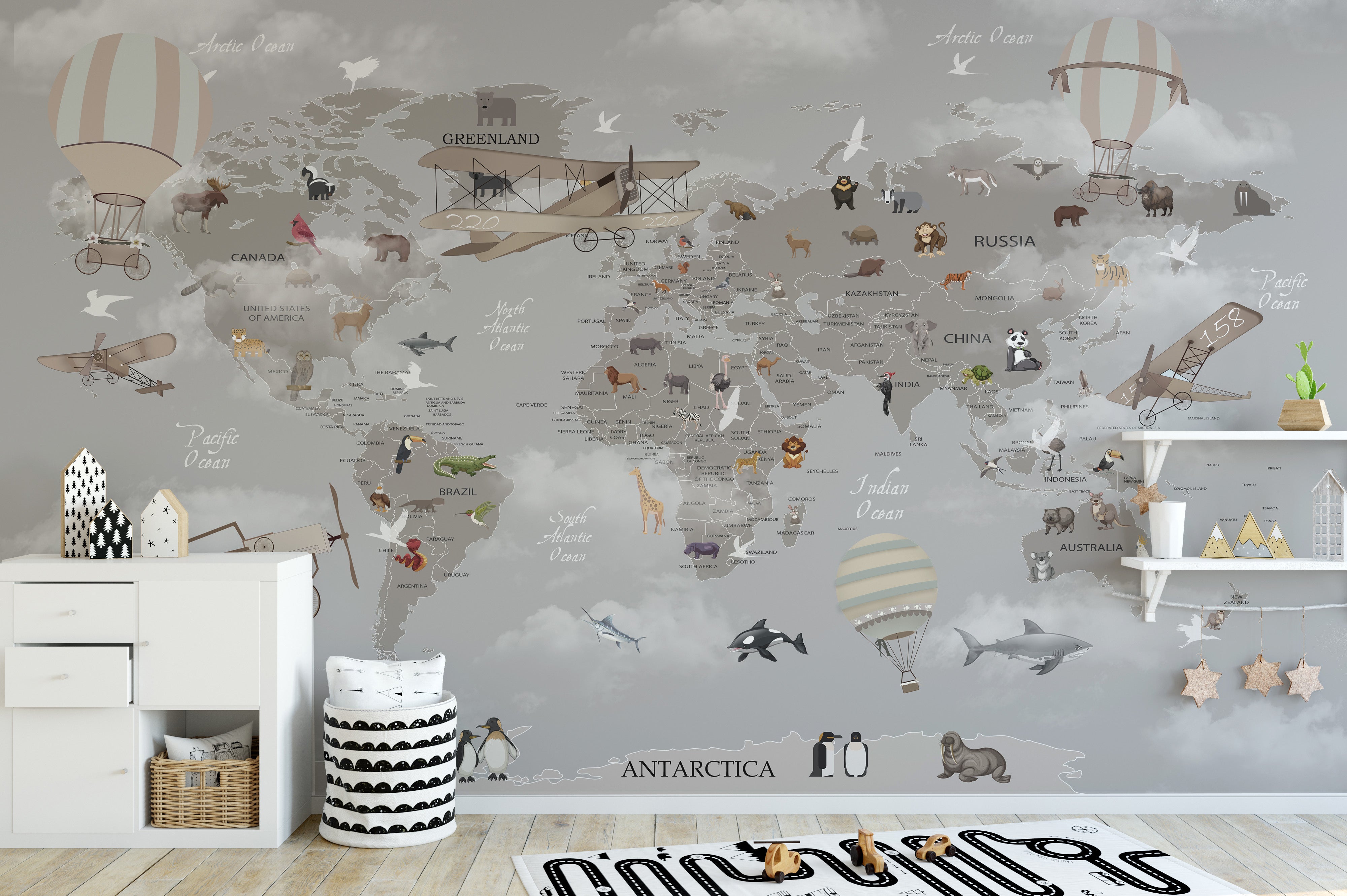 Playful gray map mural with colorful animal 