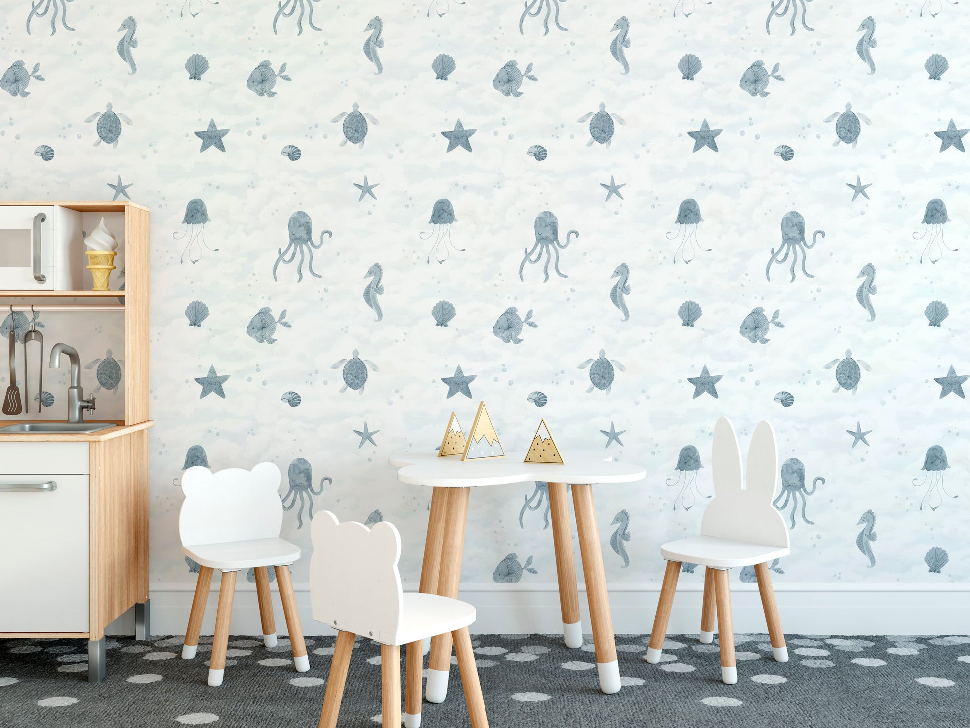 Playful sea creatures in soft blue wallpaper